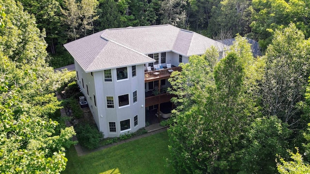 aerial view featuring a wooded view