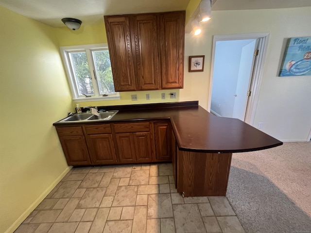 kitchen with sink and kitchen peninsula