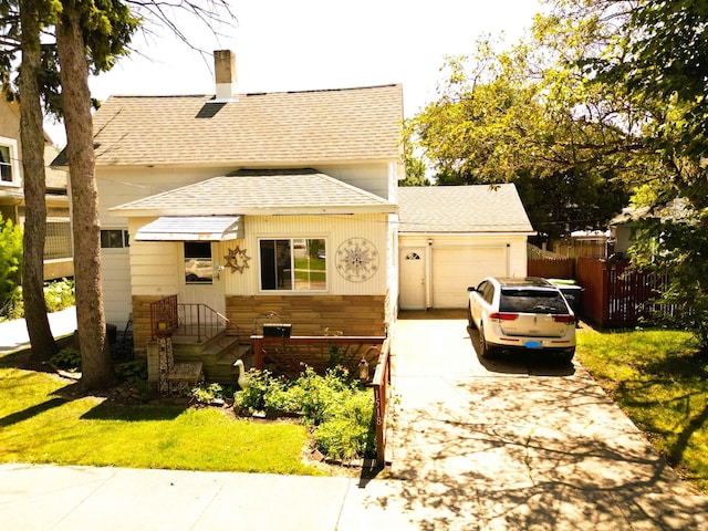 view of front of house featuring a garage and a front yard