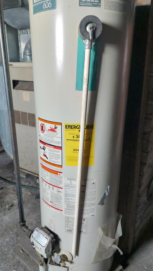 utility room featuring water heater