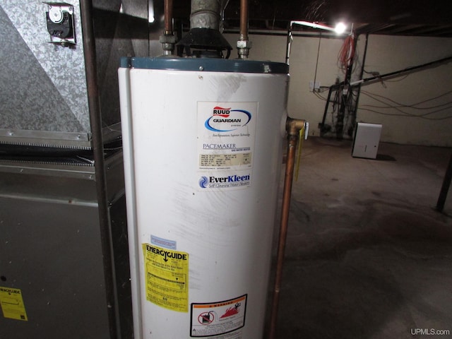 utility room featuring water heater