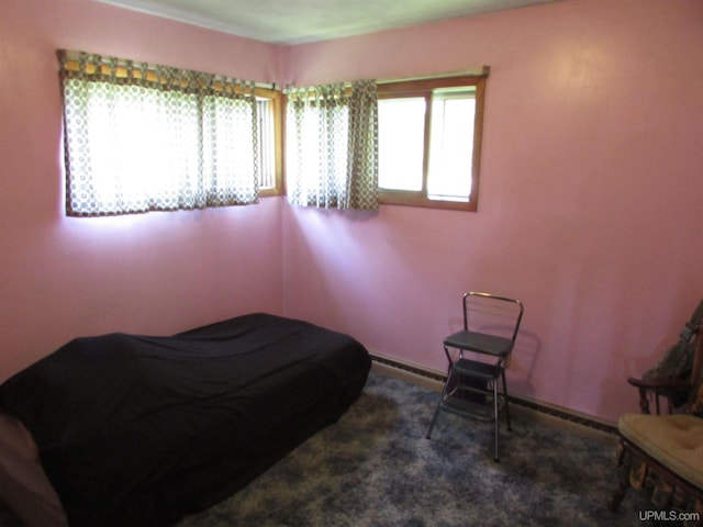 carpeted bedroom with baseboards