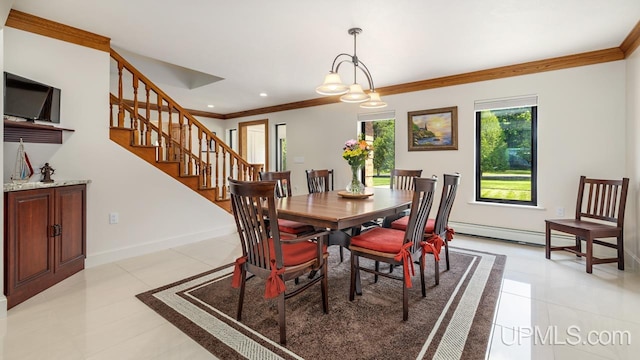 tiled dining room with an inviting chandelier, baseboard heating, and ornamental molding