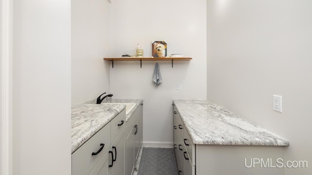 washroom with sink and tile patterned floors