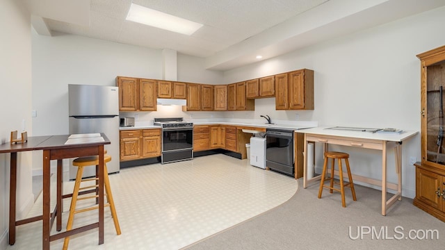 kitchen featuring sink and black appliances