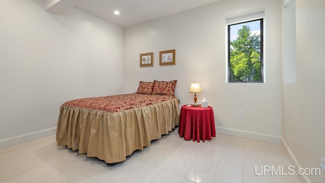 bedroom with light tile patterned flooring