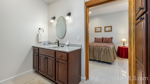 bathroom with tile patterned floors and vanity