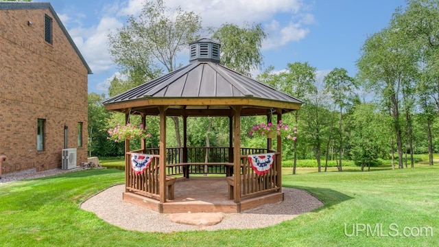 exterior space featuring a gazebo and a lawn