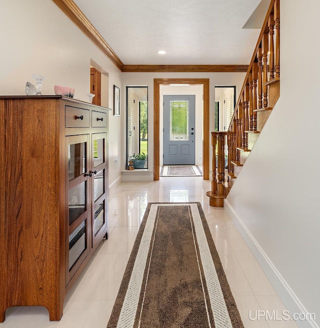 tiled entrance foyer with crown molding