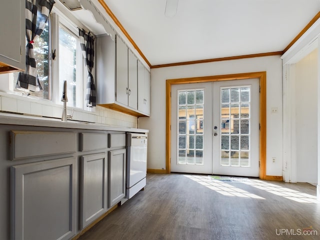 kitchen with gray cabinetry, white dishwasher, plenty of natural light, and french doors