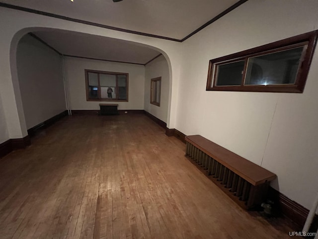 hall featuring crown molding and wood-type flooring