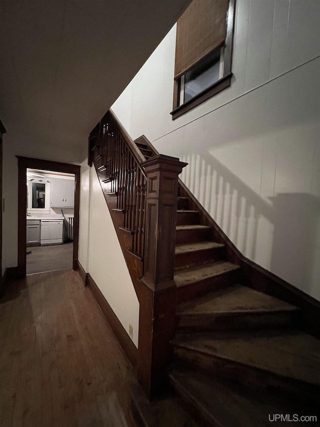 stairs with hardwood / wood-style floors