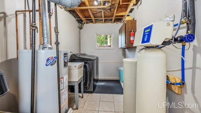 utility room with independent washer and dryer, sink, and gas water heater