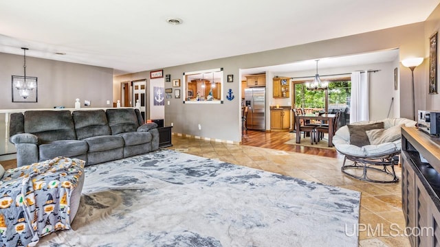 living room featuring an inviting chandelier