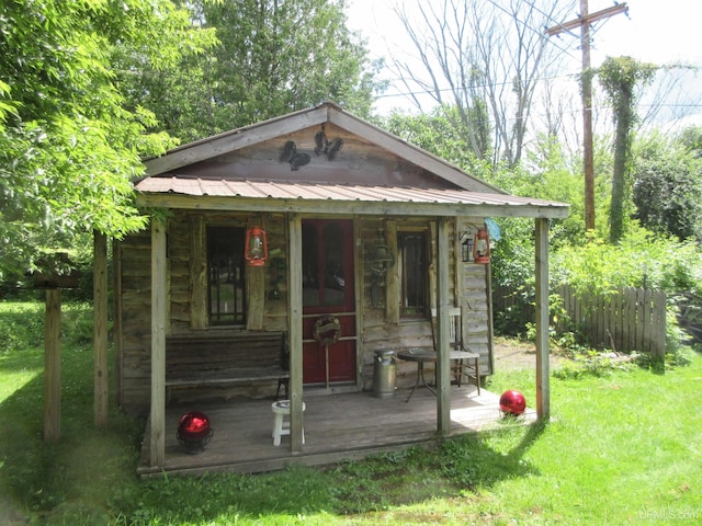 view of outbuilding featuring a yard