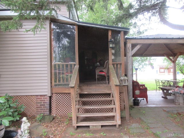 wooden deck with a patio area and a gazebo