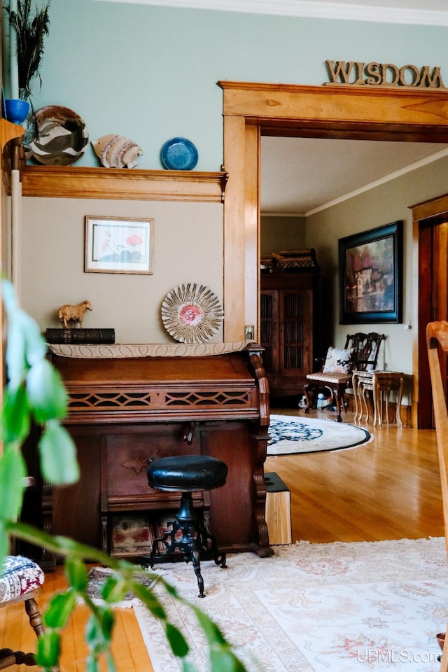 details with crown molding and hardwood / wood-style floors