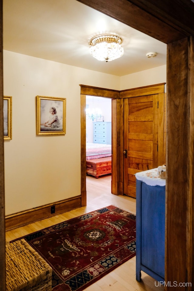 corridor featuring light hardwood / wood-style floors