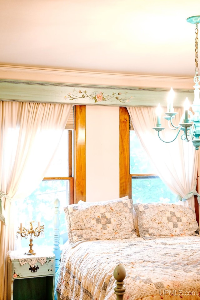 bedroom featuring an inviting chandelier