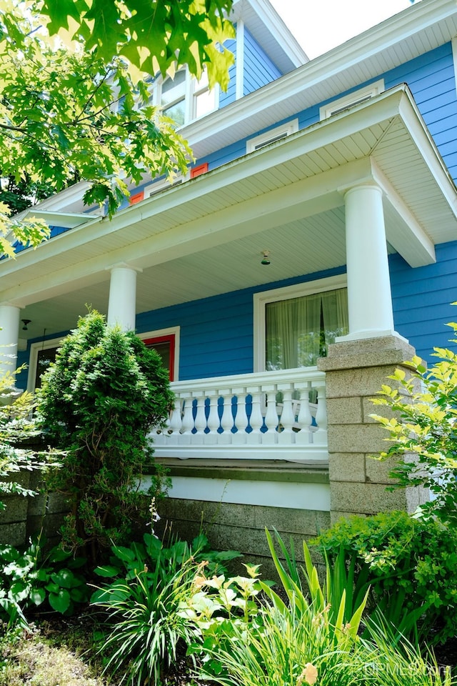 view of exterior entry with a porch