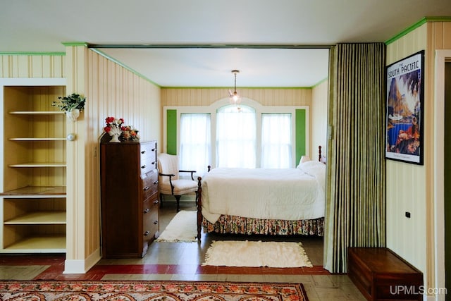 bedroom with wooden walls