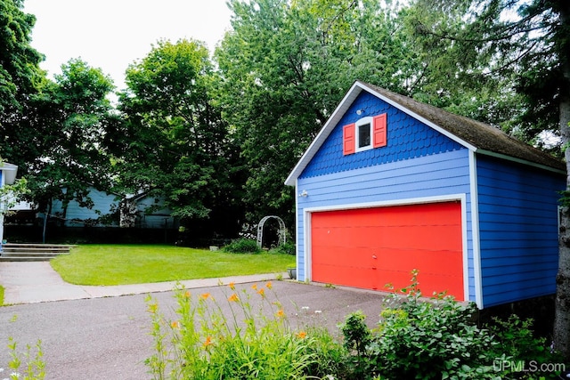 garage with a lawn