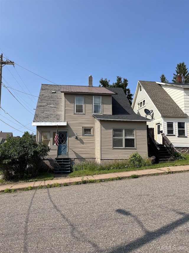 501 E N St, Ishpeming, MI 49849 - view of front of property featuring a chimney