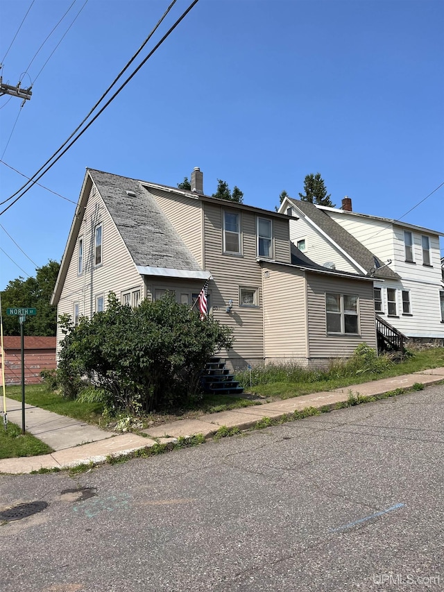 501 E N St, Ishpeming, MI 49849 - view of property exterior featuring a chimney
