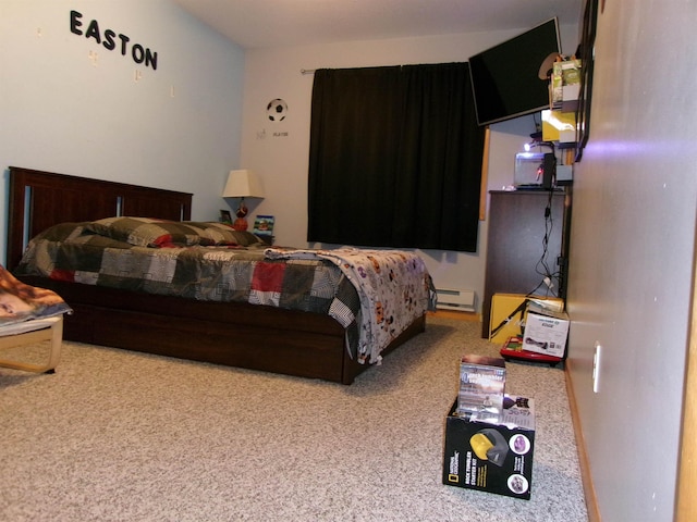 carpeted bedroom with a baseboard radiator