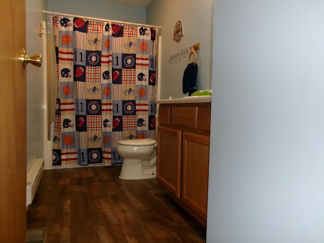 bathroom featuring curtained shower, hardwood / wood-style flooring, vanity, baseboard heating, and toilet