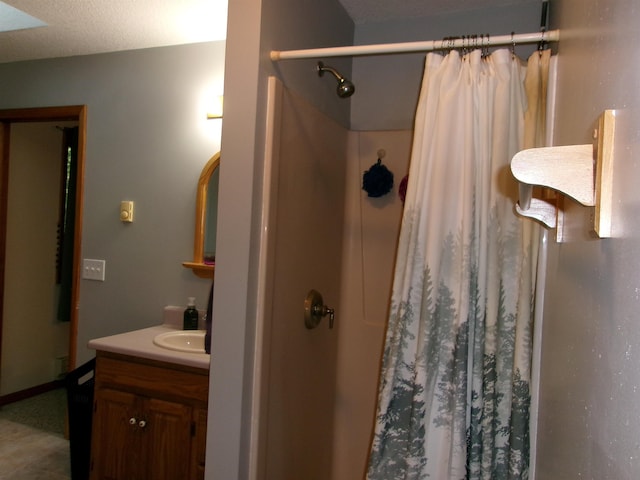 bathroom featuring vanity and walk in shower