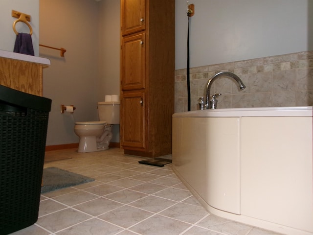 bathroom with tile patterned floors and toilet