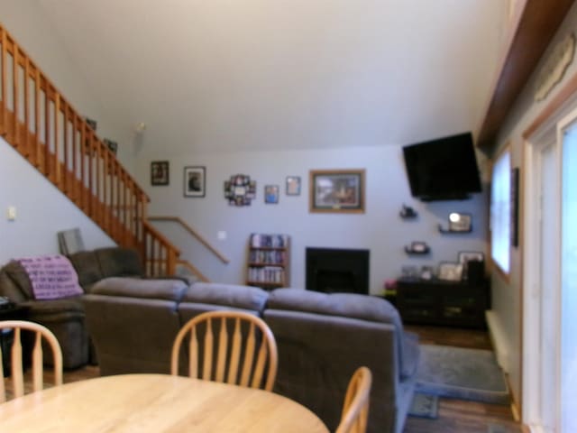 living room featuring hardwood / wood-style flooring and a fireplace