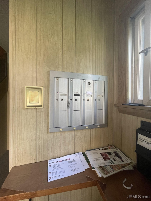 interior details featuring mail boxes and wooden walls