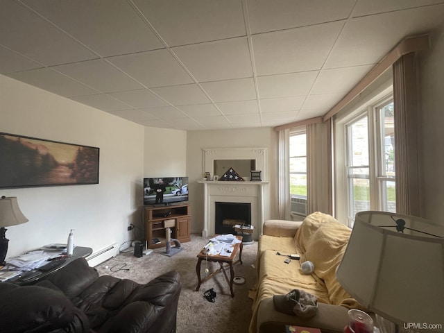 carpeted living room with baseboard heating and a paneled ceiling