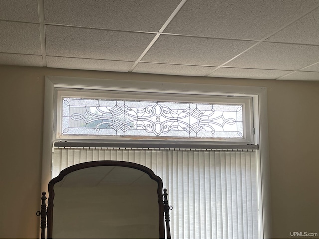 interior details featuring a paneled ceiling