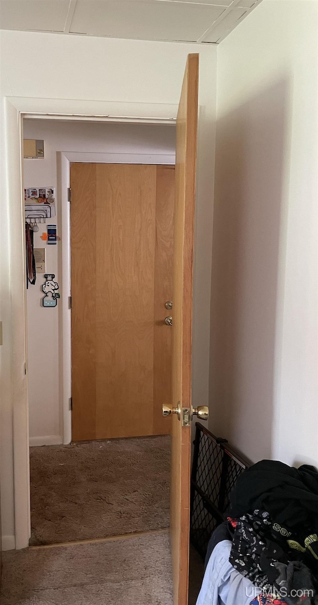 hallway with carpet floors