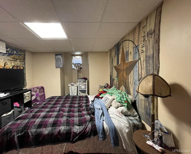 bedroom featuring a drop ceiling