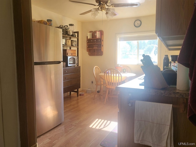 office area with ceiling fan and hardwood / wood-style flooring