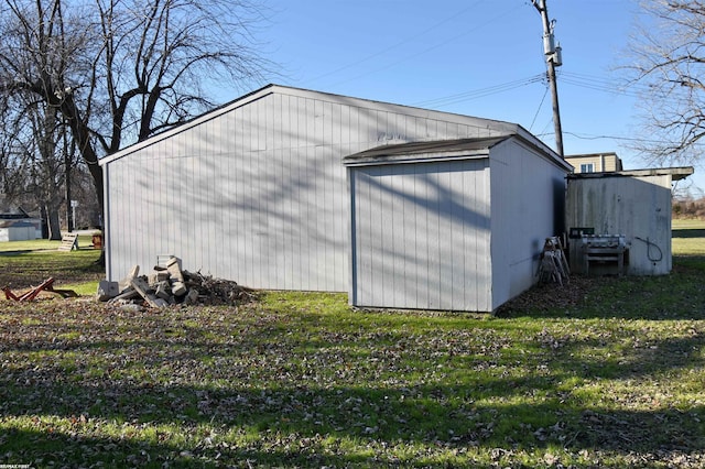 view of outbuilding with a lawn