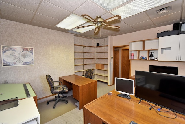 office area featuring light carpet, a paneled ceiling, and ceiling fan