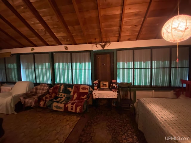 bedroom with carpet, lofted ceiling, and wood ceiling