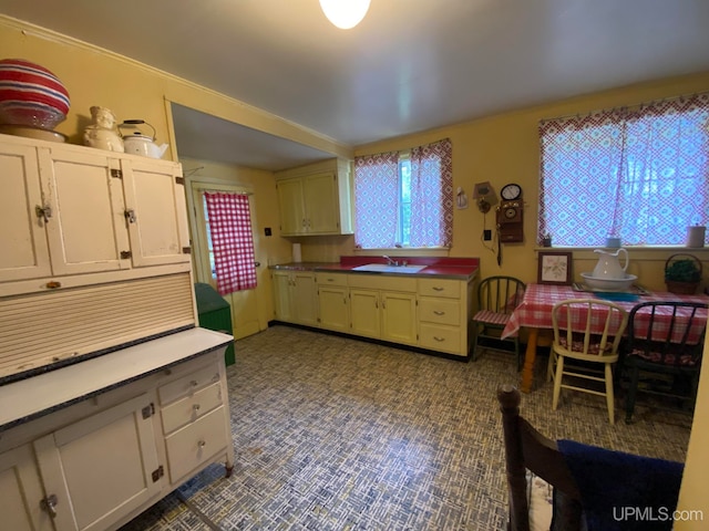 kitchen with sink and tile patterned flooring