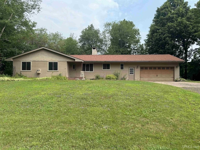 ranch-style house with a garage and a front yard