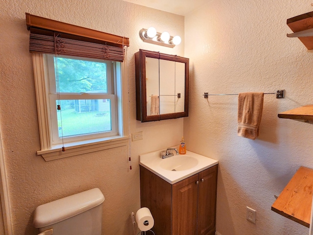 half bath with toilet and vanity
