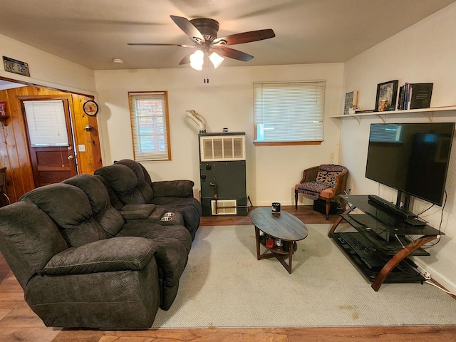 living room with hardwood / wood-style flooring and ceiling fan