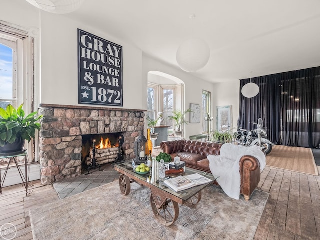 living room with a fireplace and hardwood / wood-style flooring