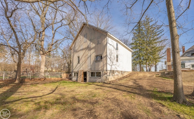 back of house with a lawn