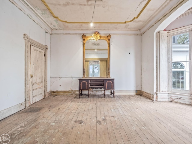 interior space featuring ornamental molding and hardwood / wood-style floors