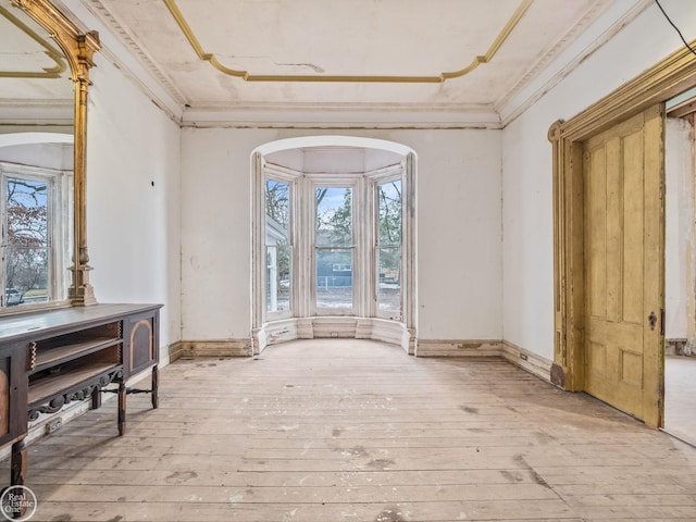 misc room with light hardwood / wood-style flooring and ornamental molding